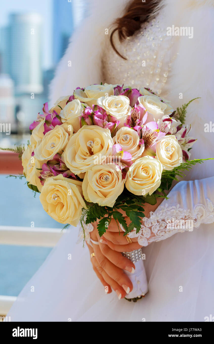the bride holding wedding bouquet of pink and white roses Stock Photo ...