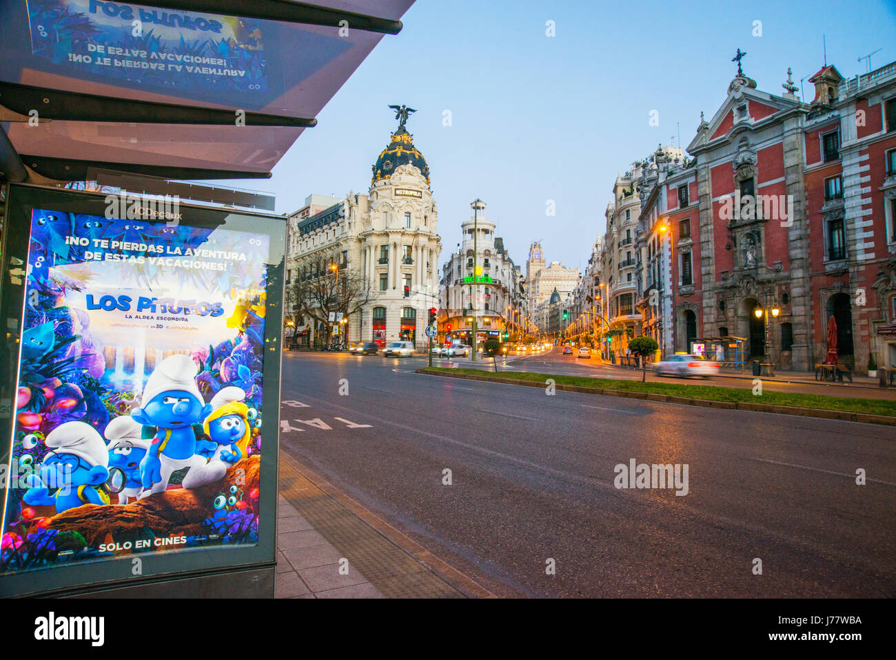 Bus stop and Gran Via street at dawn. Alcala street, Madrid, Spain. Stock Photo