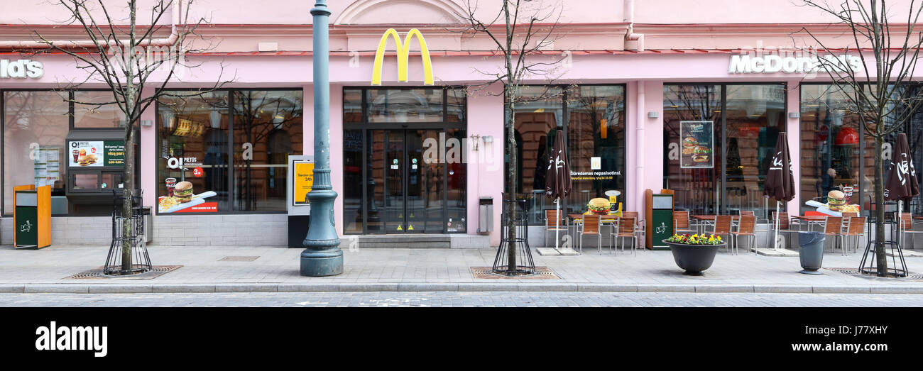 VILNIUS, LITHUANIA -APRIL 30, 2017: The biggest restaurant McDonalds is located on the first floor of the pink historical building on the street of a  Stock Photo