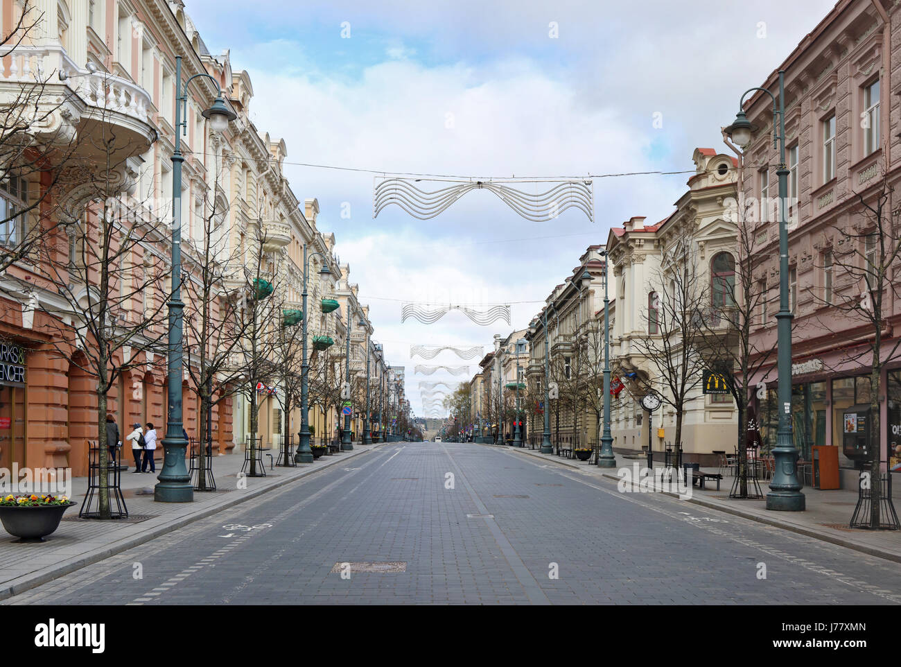 VILNIUS, LITHUANIA -APRIL 30, 2017: Perspective  of the main central spring street of the Lithuanian capital - Gediminas Avenue. Sunday April morning, Stock Photo