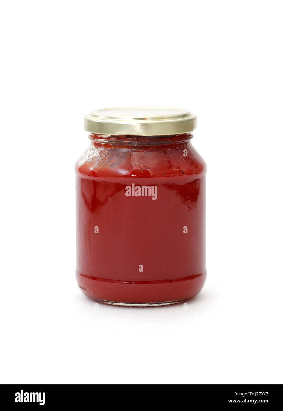 Glass jar with tomato paste isolated on white background. Clipping path