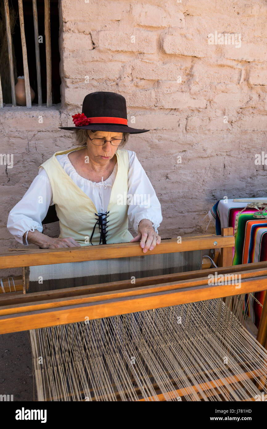 Tucson, Arizona - A costumed reenactor demonstrates weaving during Living History Day at the Tucson Presidio. The original Spanish fortress was built  Stock Photo