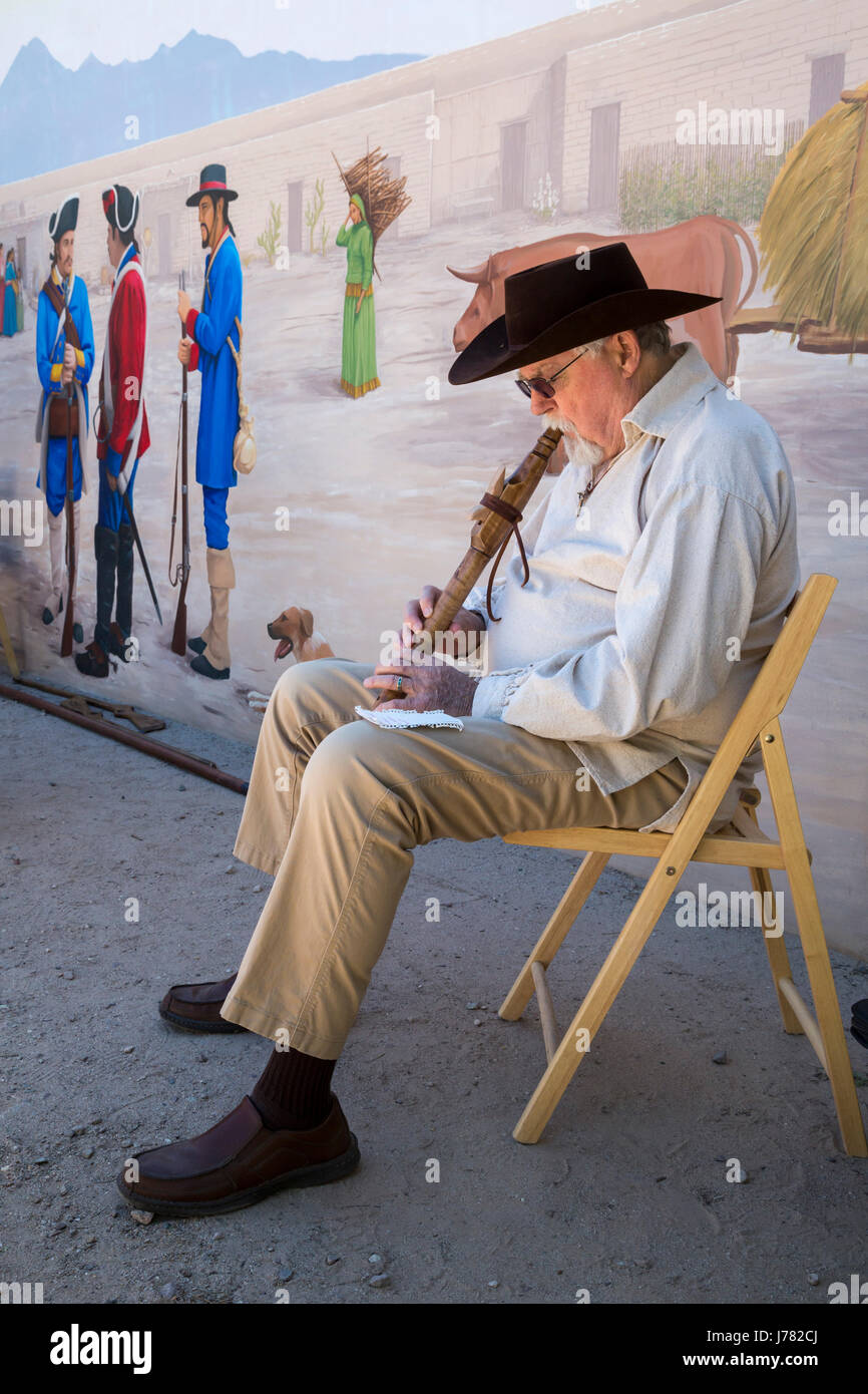 Tucson, Arizona - A man plays a flute during Living History Day at the Tucson Presidio. The original Spanish fortress was built in 1775. Today's Presi Stock Photo