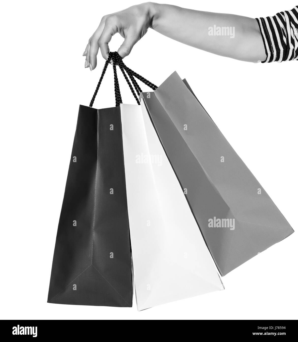 Shopping. The French way. Closeup on hands with shopping bags of the