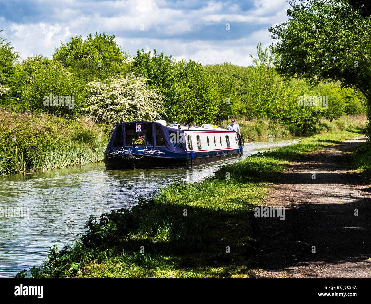A houseboat along the Kennet and Avon Canal near Little Bedwyn in Wiltshire. Stock Photo