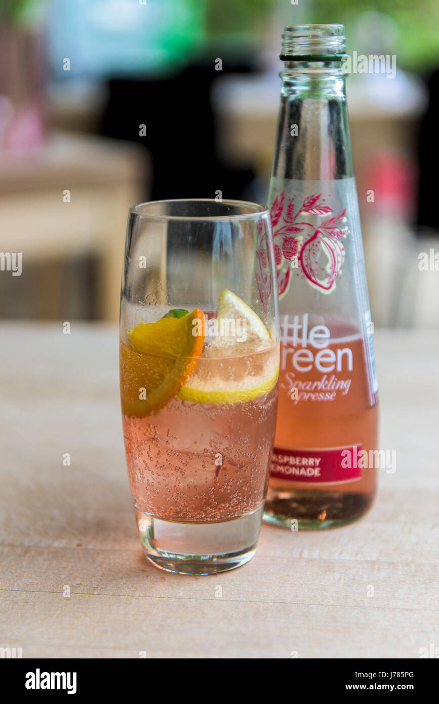 A bottle of Bottle Green Soft drink; Sparkling presse; Rasberry and lemonade; Sparkling water drink; Refreshing; Cool drink Stock Photo