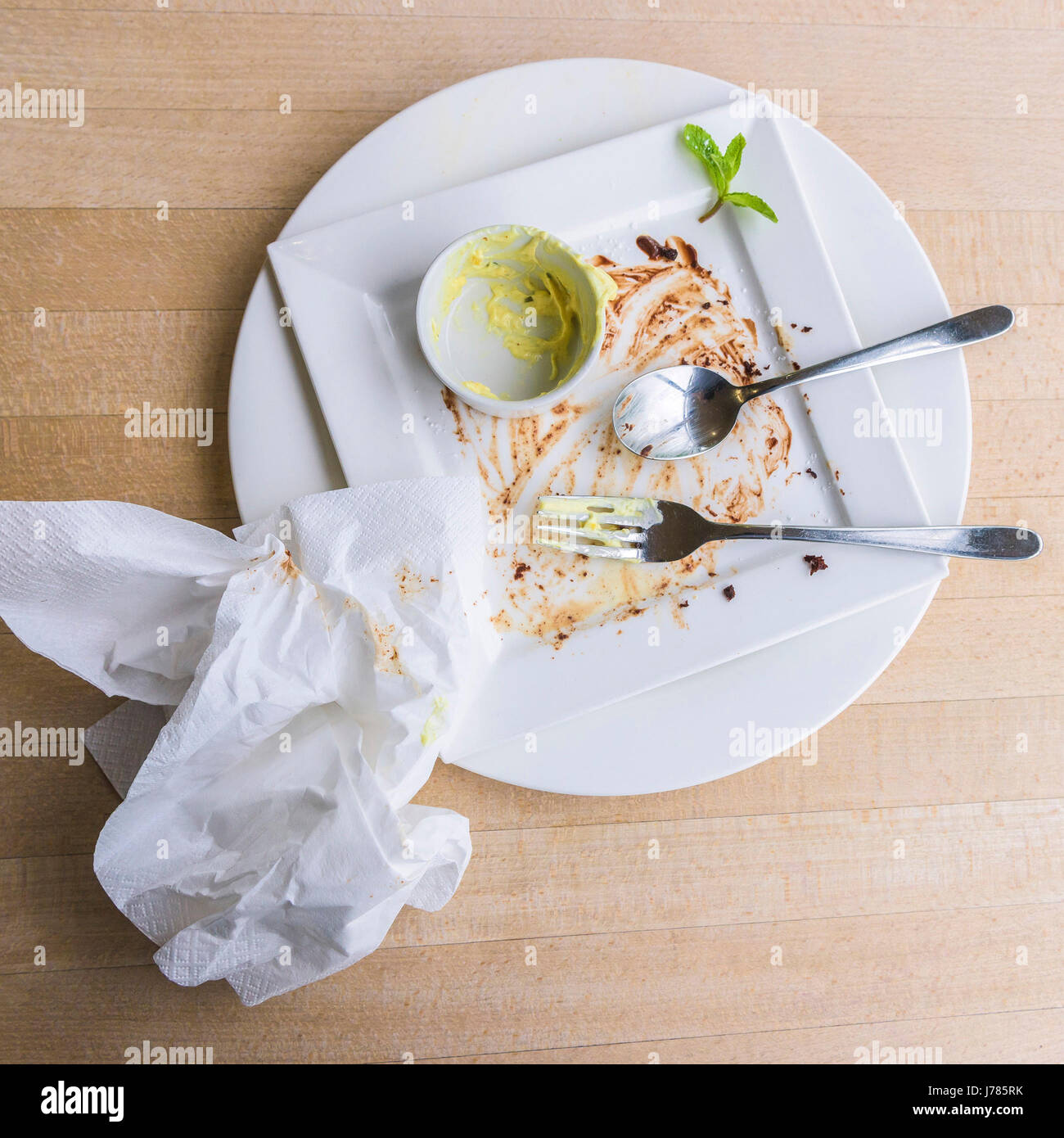 An overhead view of the remains of a meal. Stock Photo