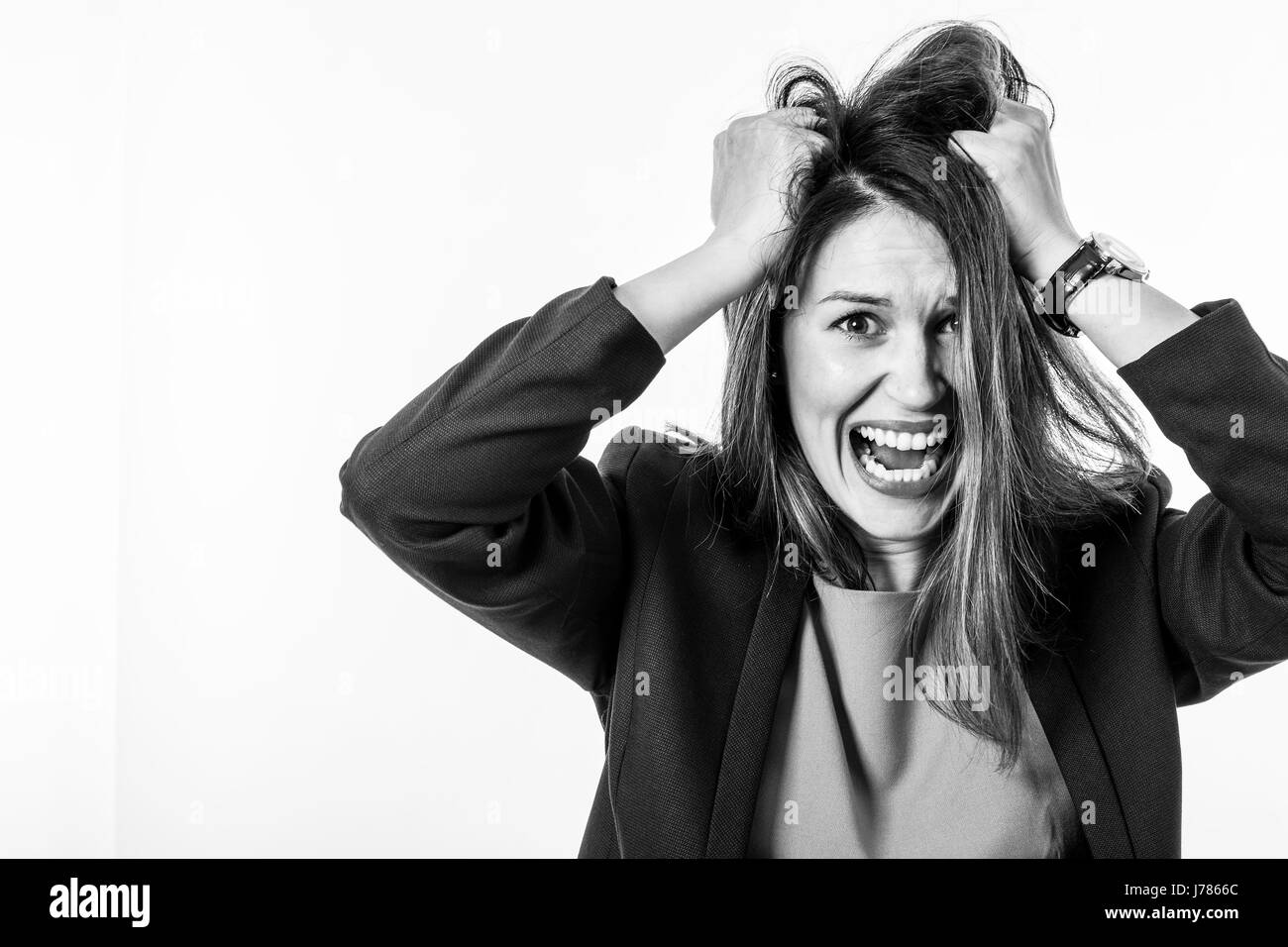 Portrait of a Stressed Young Woman with Screaming Face Expression Stock Photo