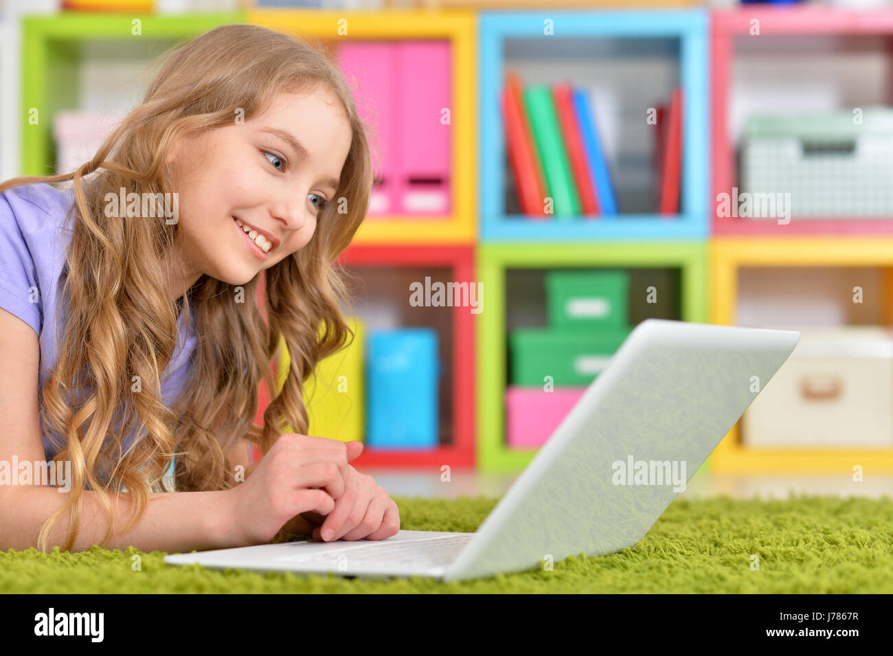 Portrait of a teenage girl using a laptop Stock Photo - Alamy