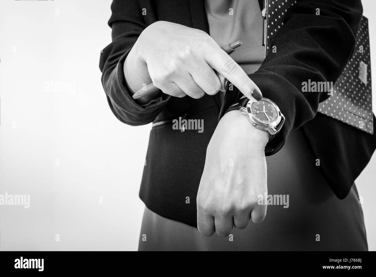 Business Woman Pointing to His Watch Isolated on a White Background Stock Photo