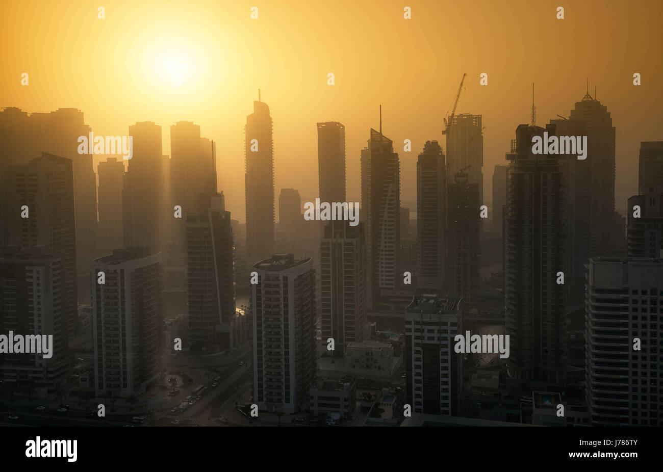 Dubai Marina skyscrapers at sunset with heat haze. May 2017 Stock Photo