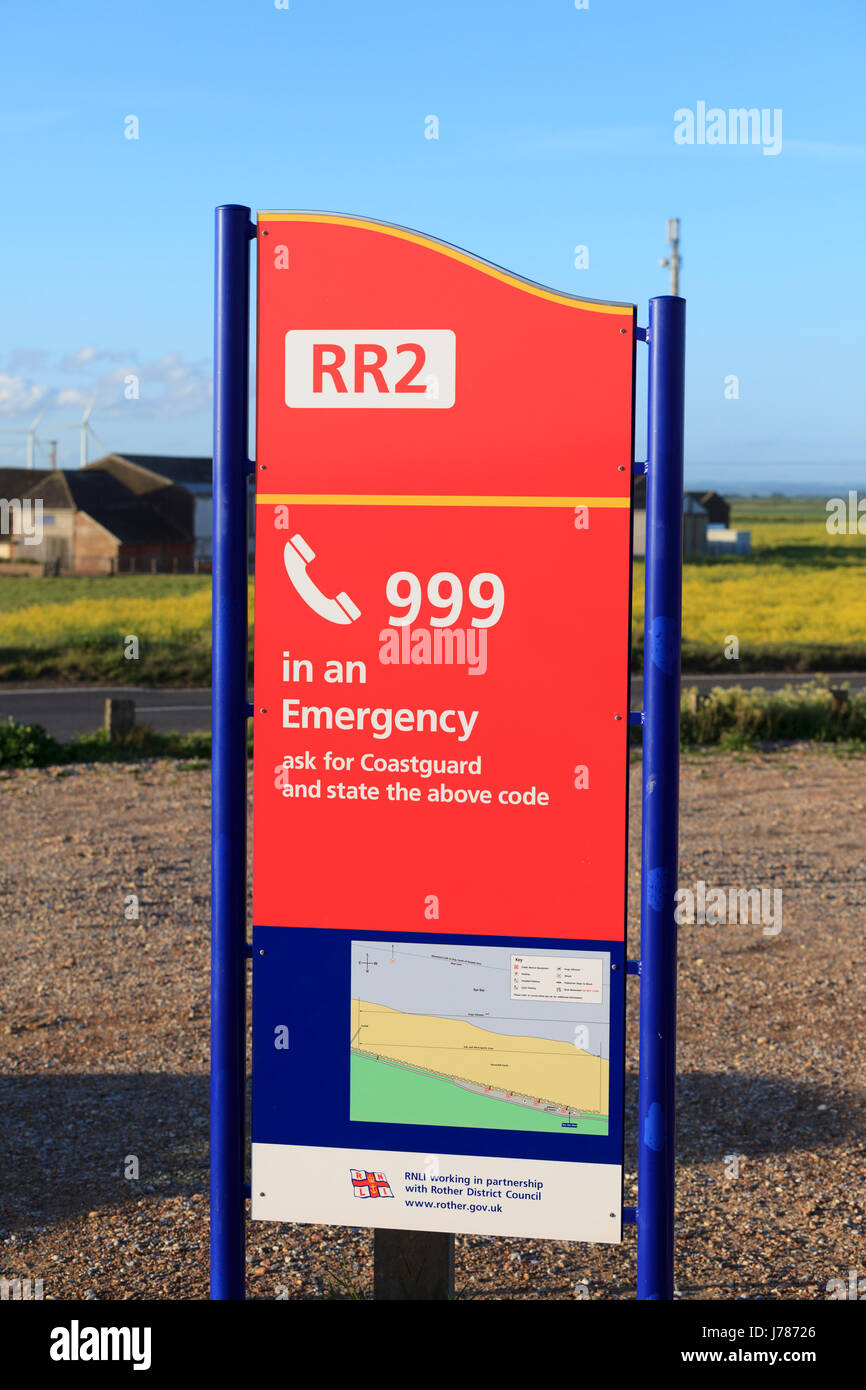 Coastguard RR2 call 999 in an emergency sign on a beach in camber sands, uk Stock Photo