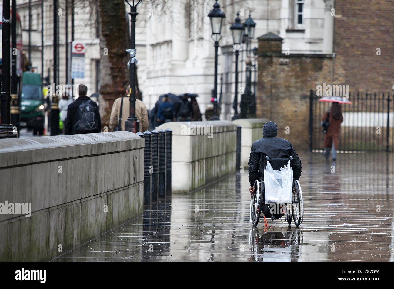 LONDON, ENGLAND March 30, 2017 Disabled person in a wheelchair rides
