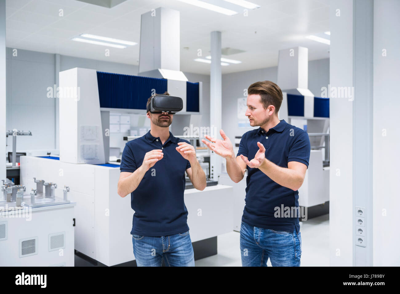 Two men in testing instrument room with VR glasses Stock Photo Alamy