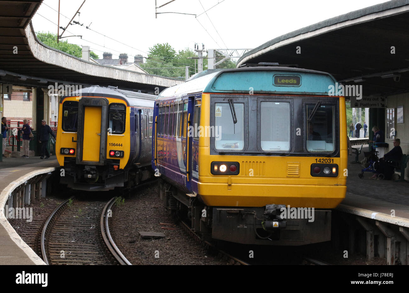 Two diesel multiple units in Carnforth station, one class 156 super sprinter and one Class 142 pacer, both operated by Arrive Trains North (Northern). Stock Photo
