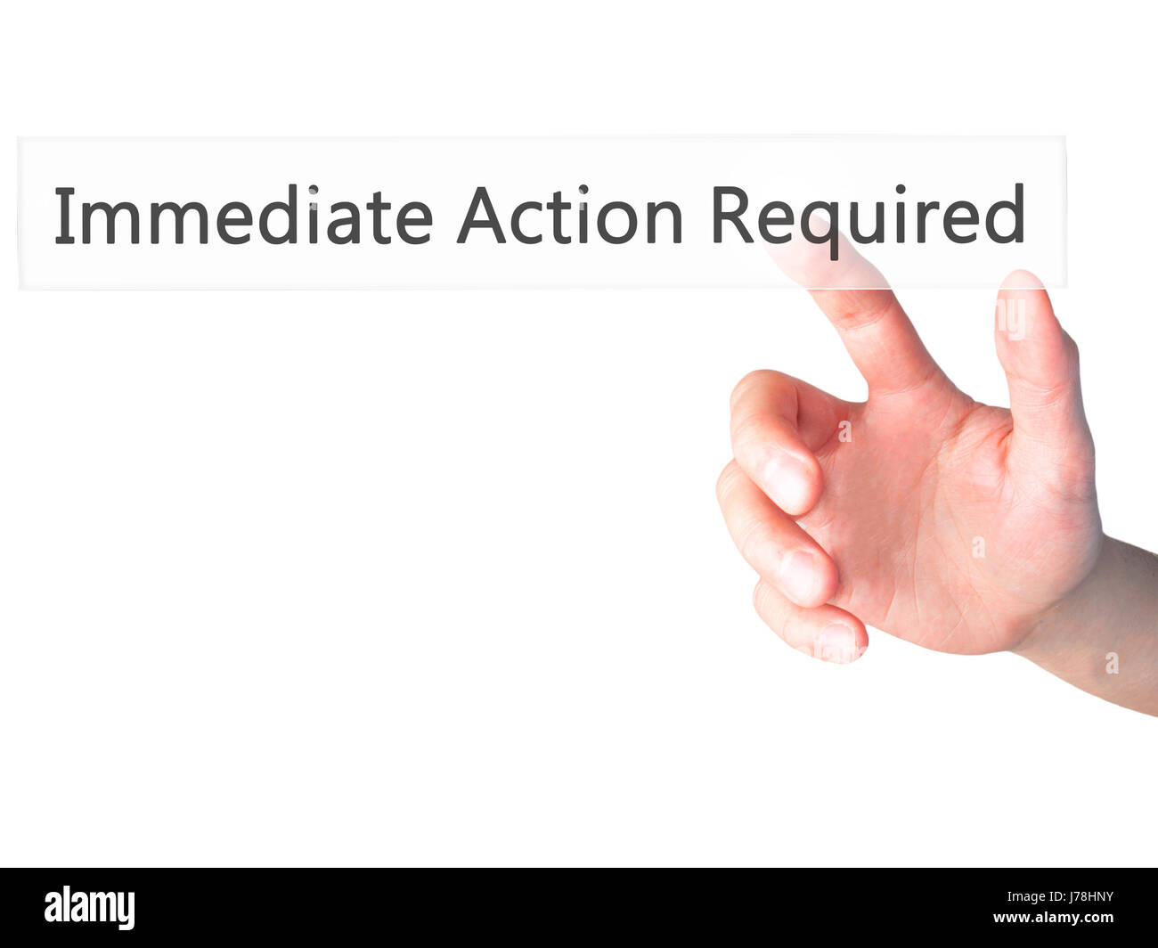 Immediate Action Required - Hand pressing a button on blurred background concept . Business, technology, internet concept. Stock Photo Stock Photo