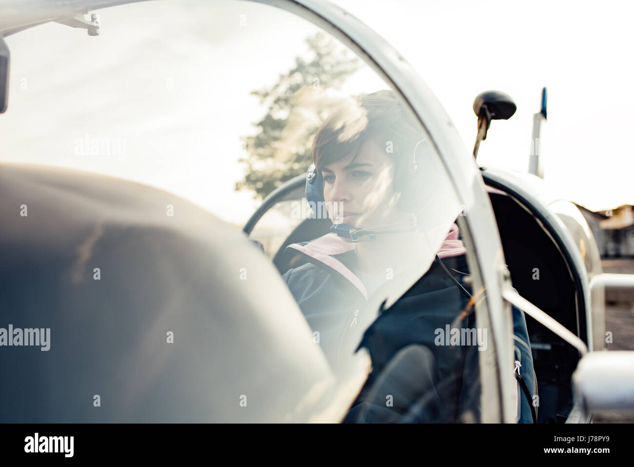 Female pilot smiling in cockpit hi-res stock photography and images - Alamy