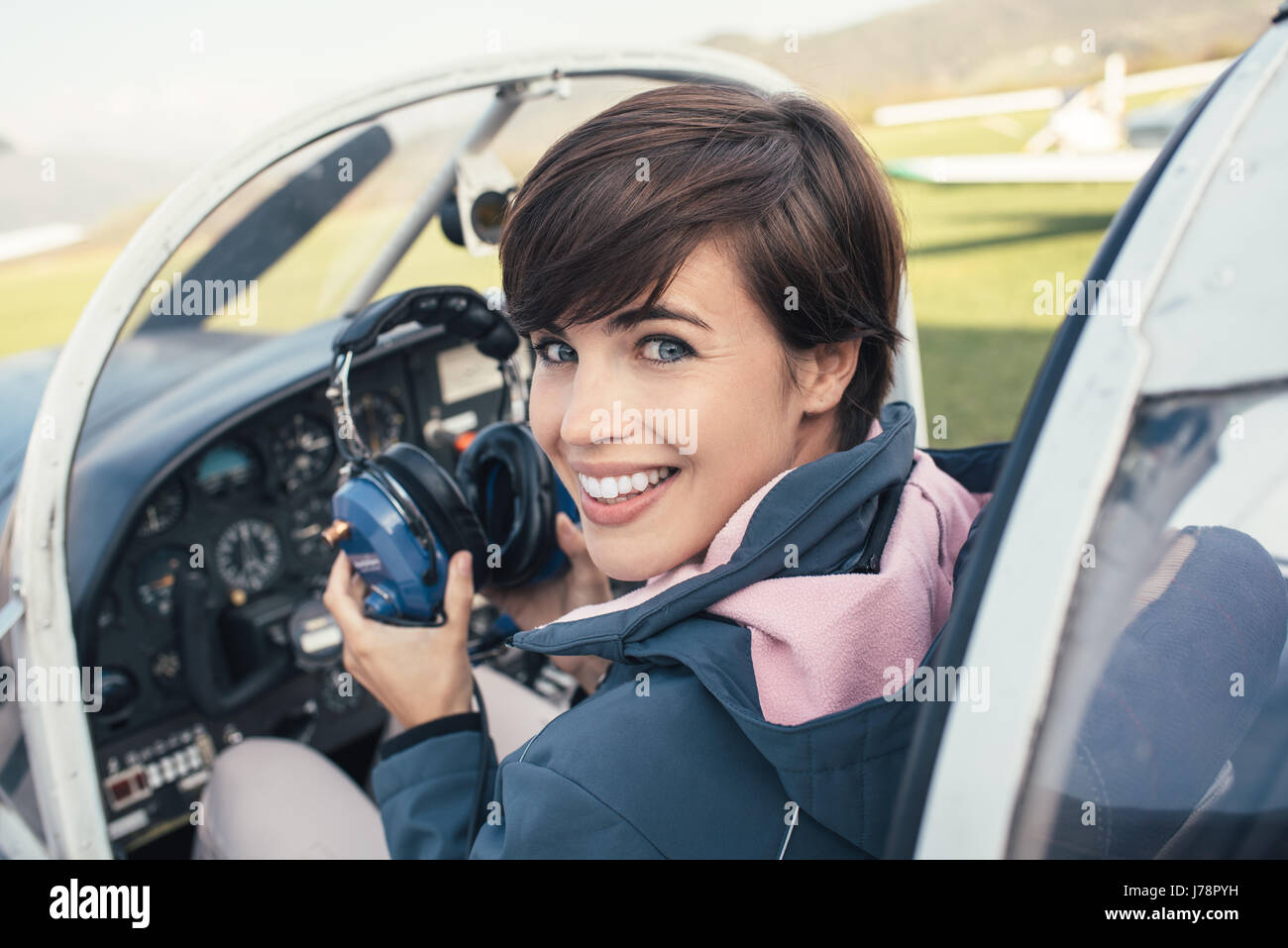 Female pilot smiling in cockpit hi-res stock photography and images - Alamy