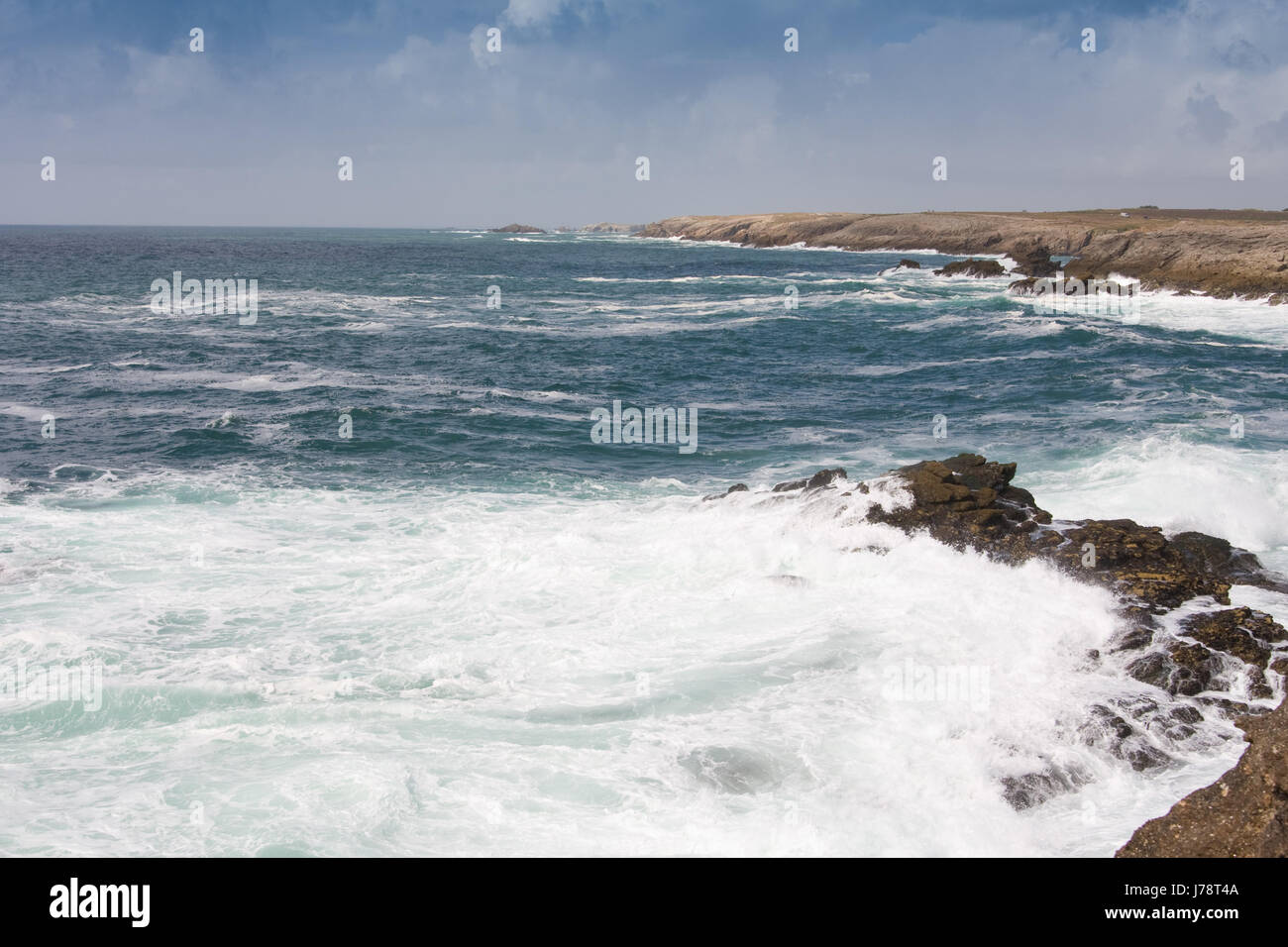 rock coast surf risacca surge breaking of waves brittany horizon wild beach Stock Photo