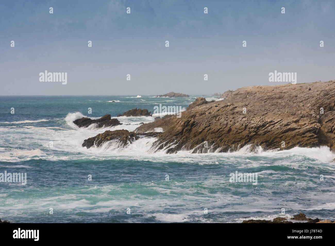 rock coast surf risacca surge breaking of waves brittany horizon wild beach Stock Photo