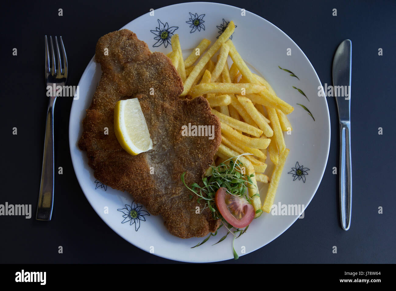 Wiener Schnitzel served with fries at Interlaken in Switzerland. The