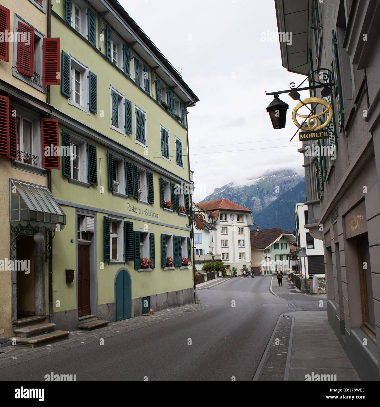 The Restaurant Steinbock and street at Interlaken in Switzerland. The municipality is a gateway the the Alps and Jungfrau Region. Stock Photo