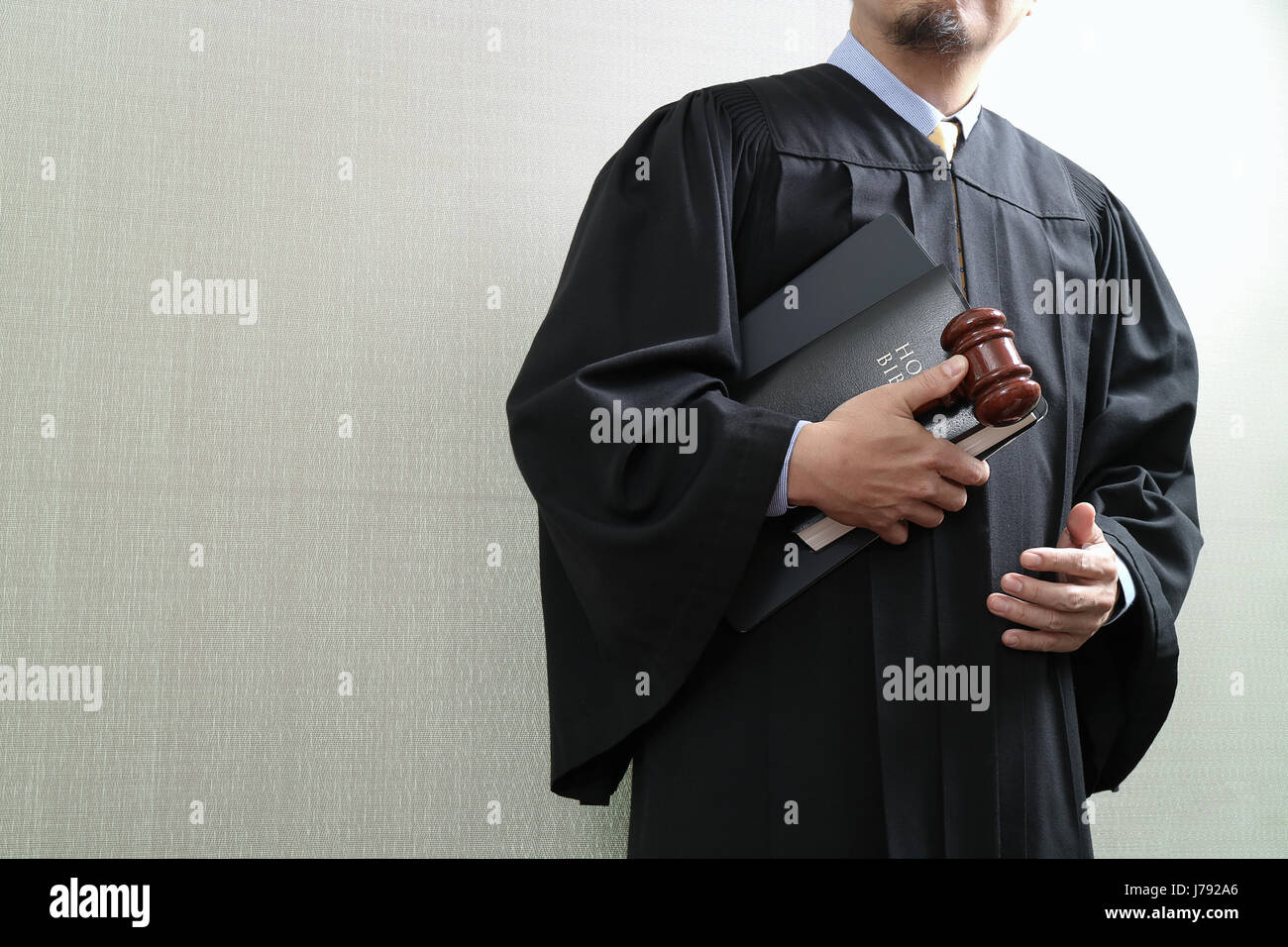 justice and law concept.Male judge in a courtroom with the gaveland holy book and digital tablet computer Stock Photo