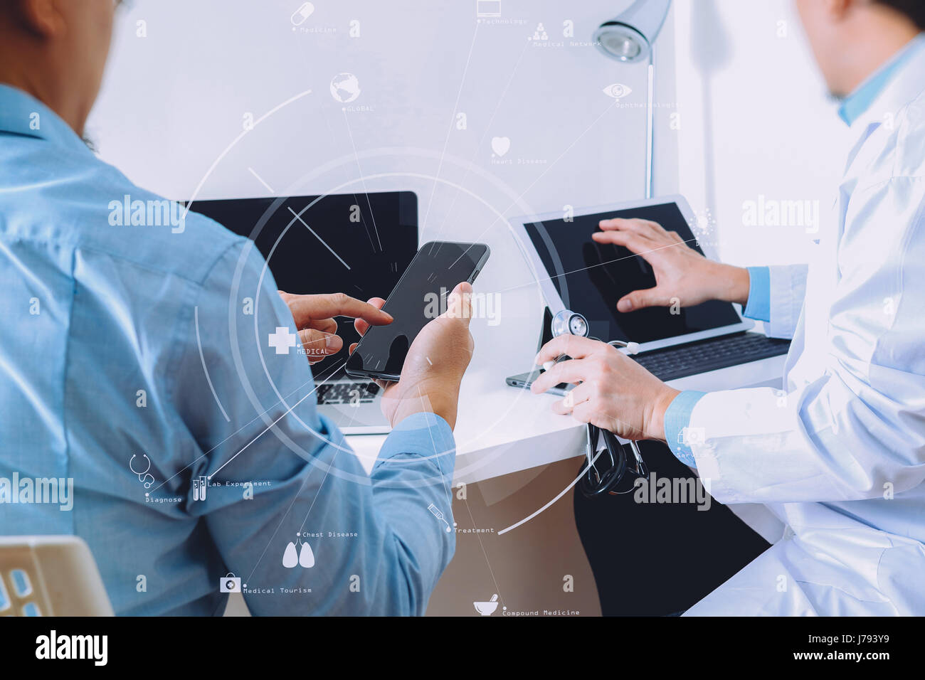 Medical doctor in white uniform gown coat consulting businessman patient having exam as Hospital professionalism concept with VR icon diagram Stock Photo