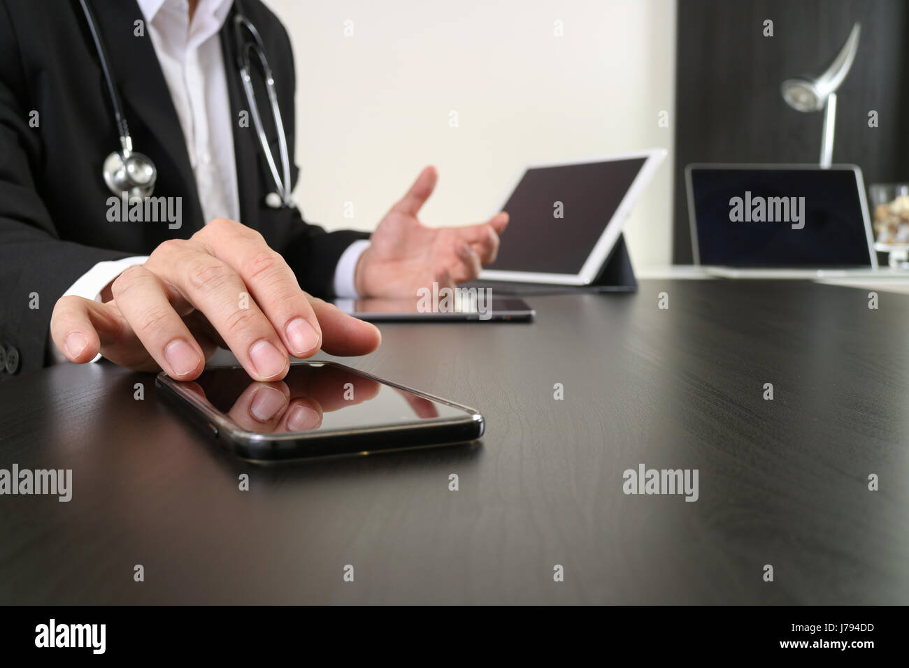 smart medical doctor working with smart phone and digital tablet and ...