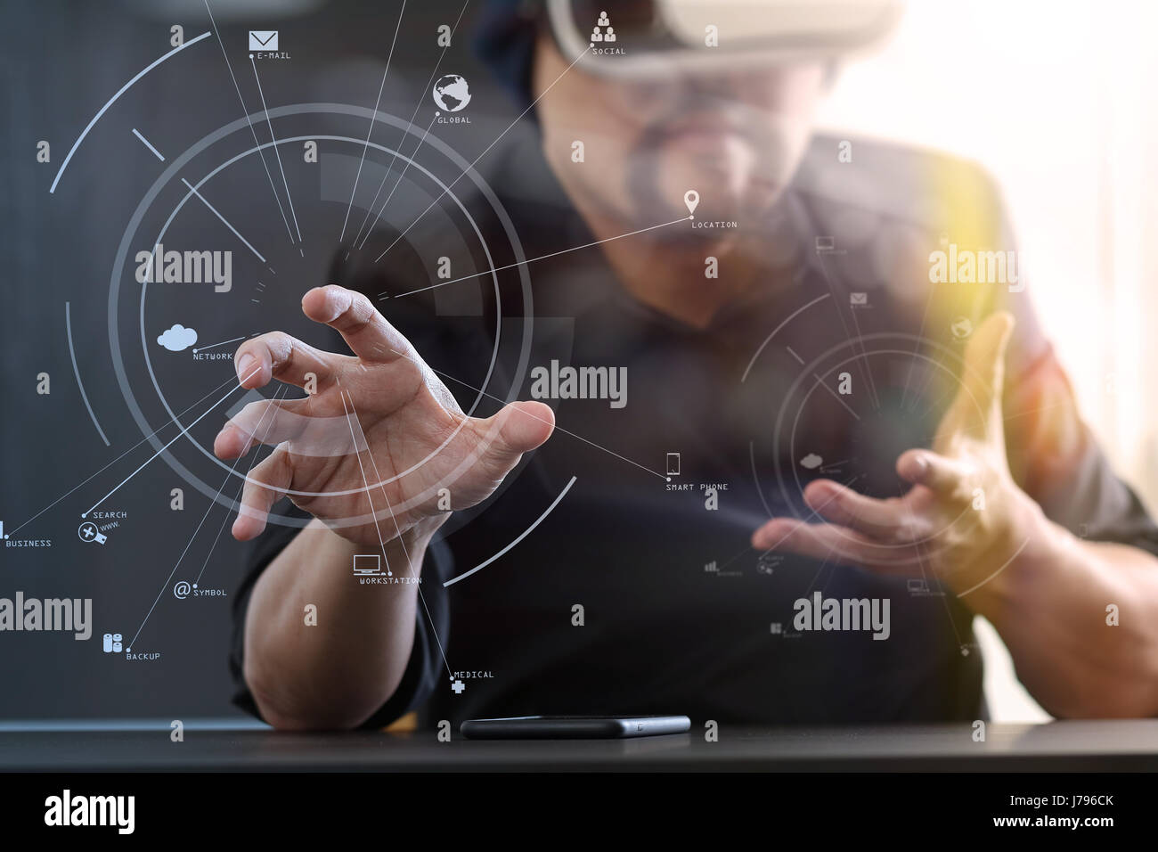 businessman wearing virtual reality goggles in modern office with ...
