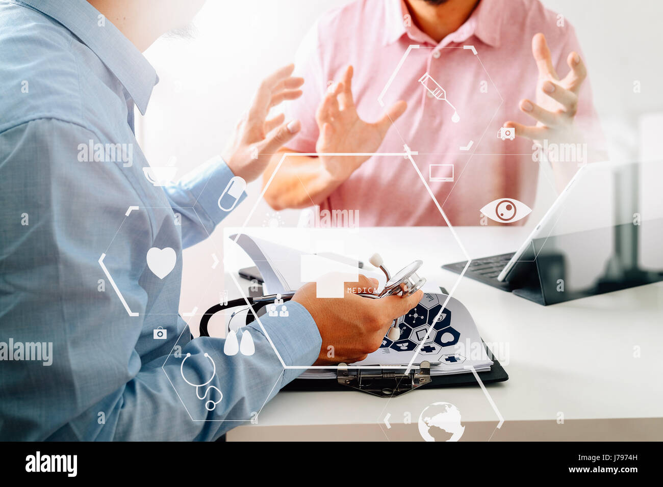 Medical doctor using mobile phone and consulting businessman patient having exam as Hospital professionalism concept with VR icon diagram Stock Photo