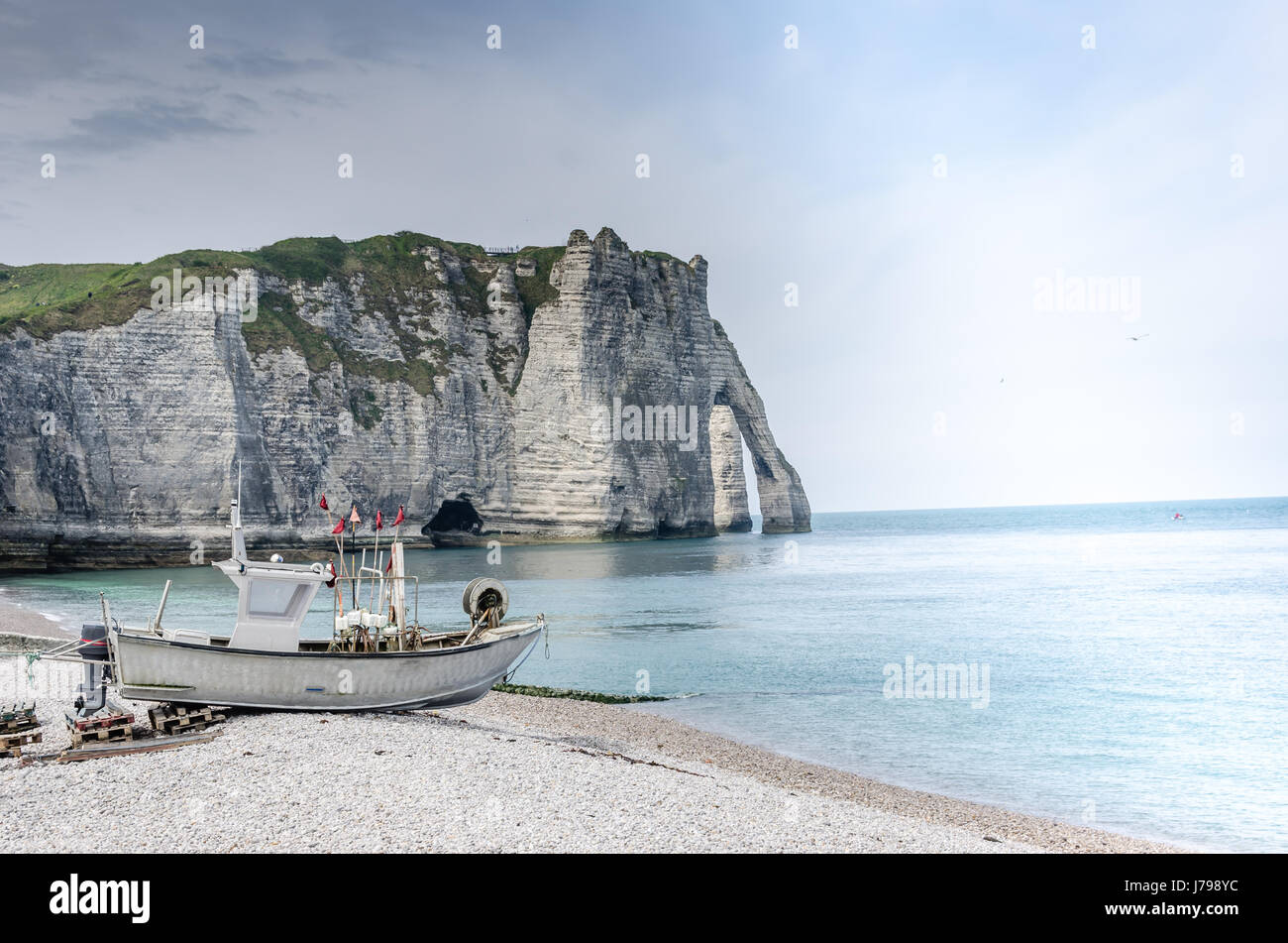 Boat and famous cliffs of Etretat Stock Photo - Alamy
