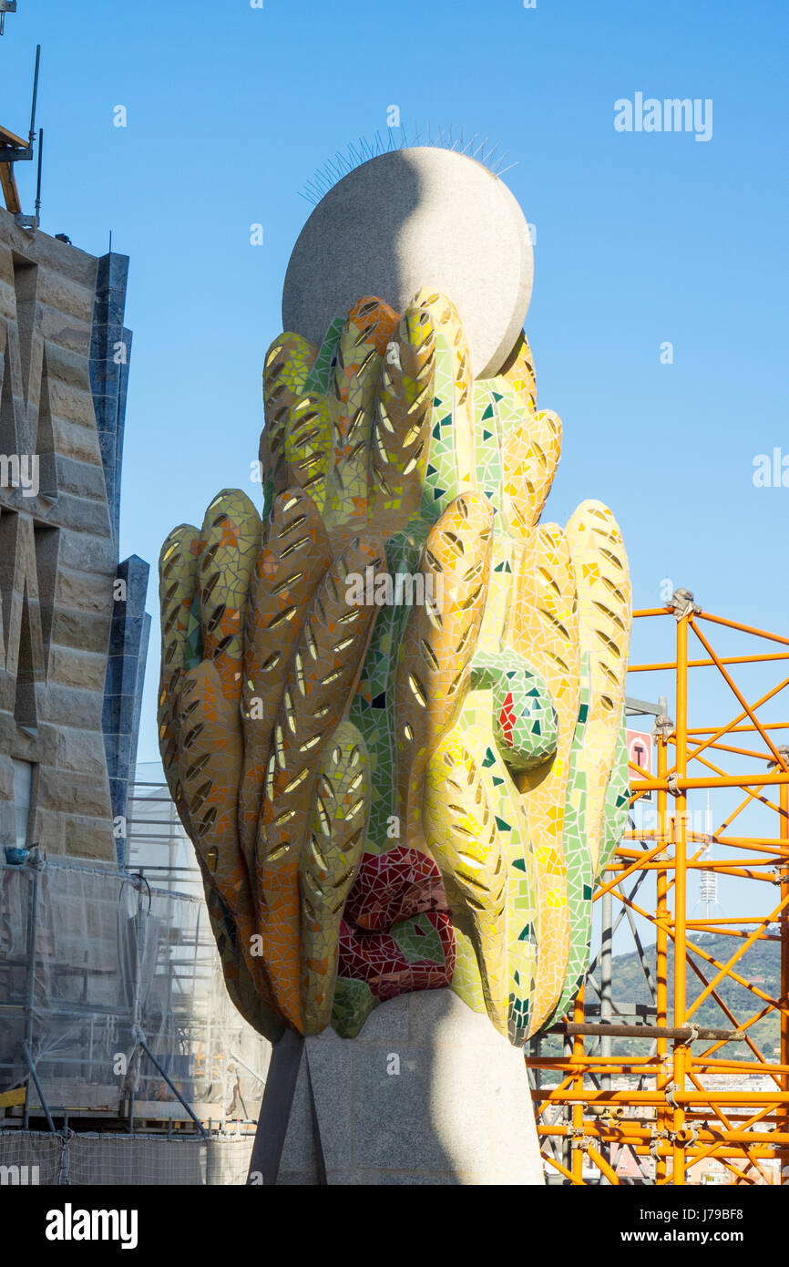 Ornamental sculpture on the pinnacle of a spire of Gaudi's Sagrada ...