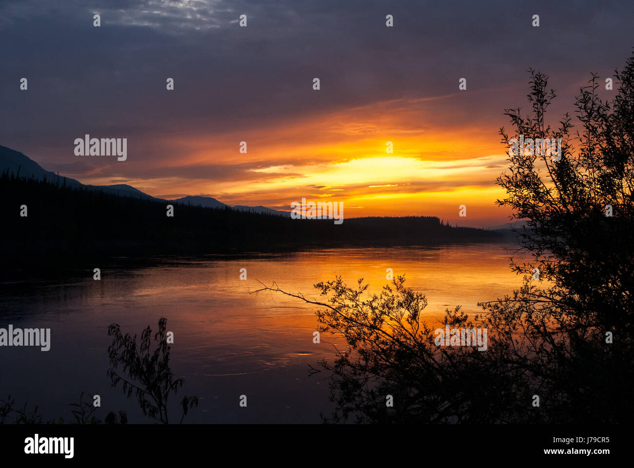 Sunset at Teslin river in Yukon territory, Canada Stock Photo