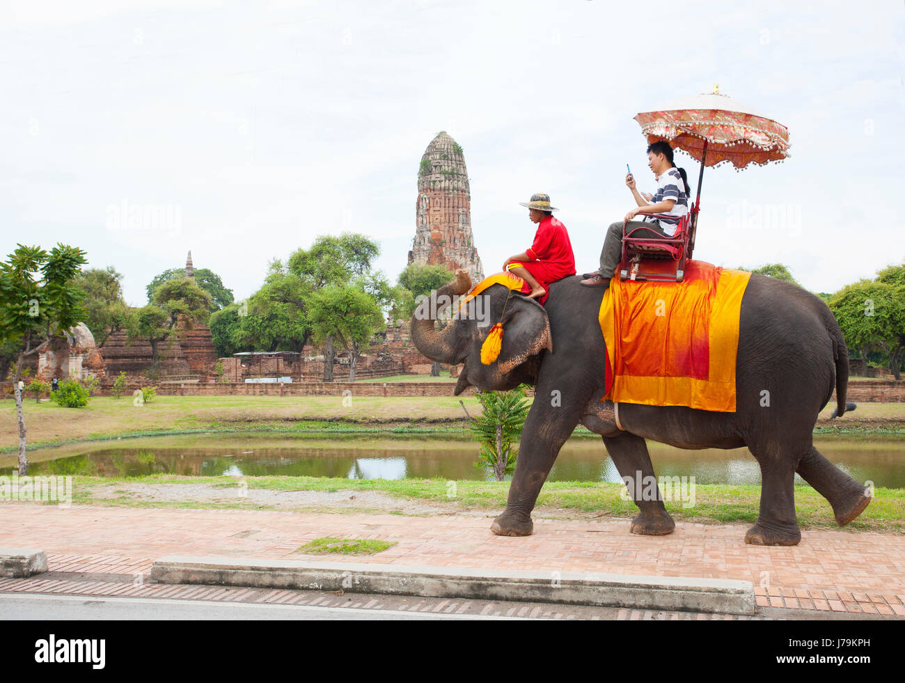 AYUTHAYA THAILANDSEPTEMBER 6 tourist riding on elephant back past
