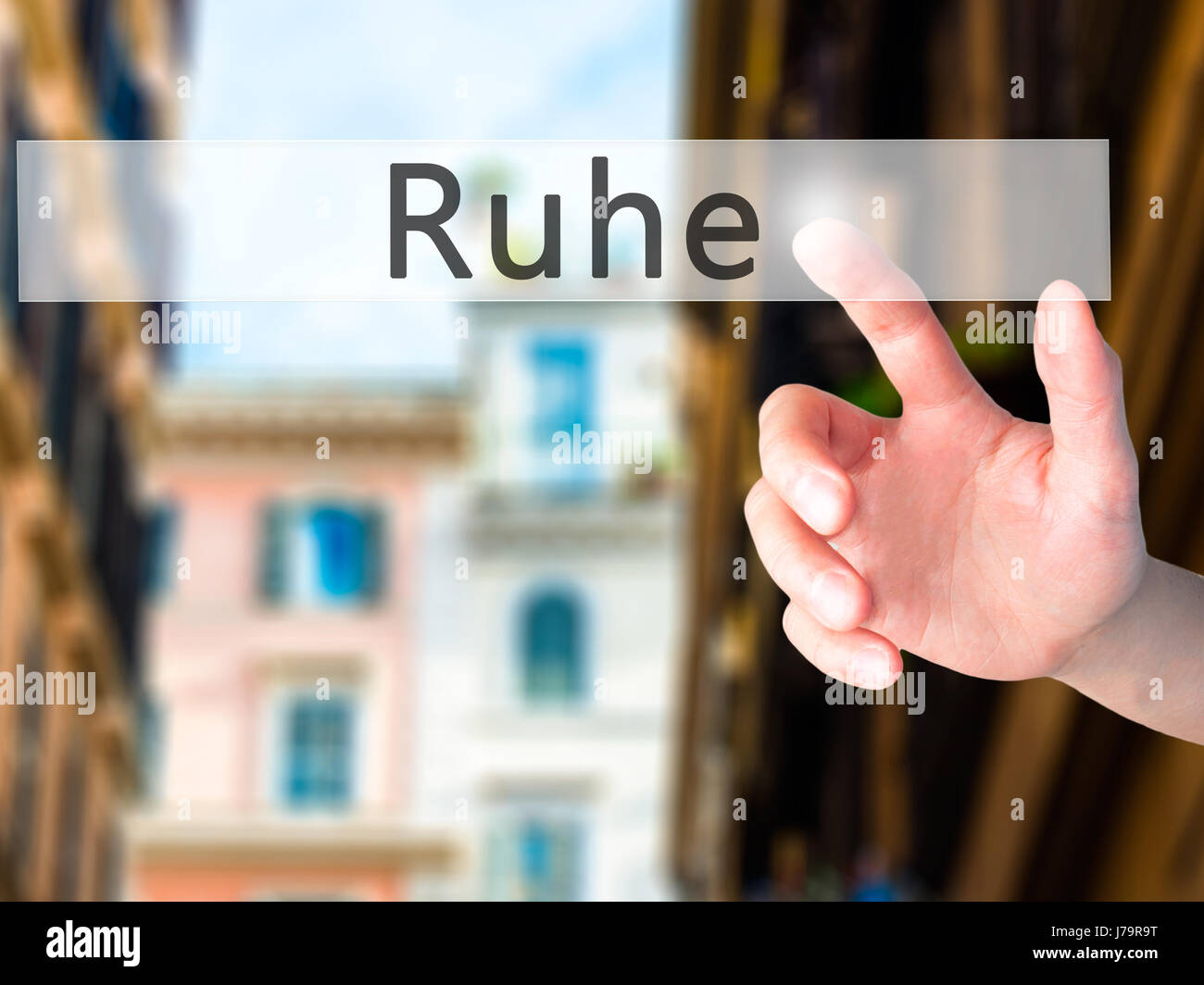Ruhe (Quiet in German) Hand pressing a button on blurred background