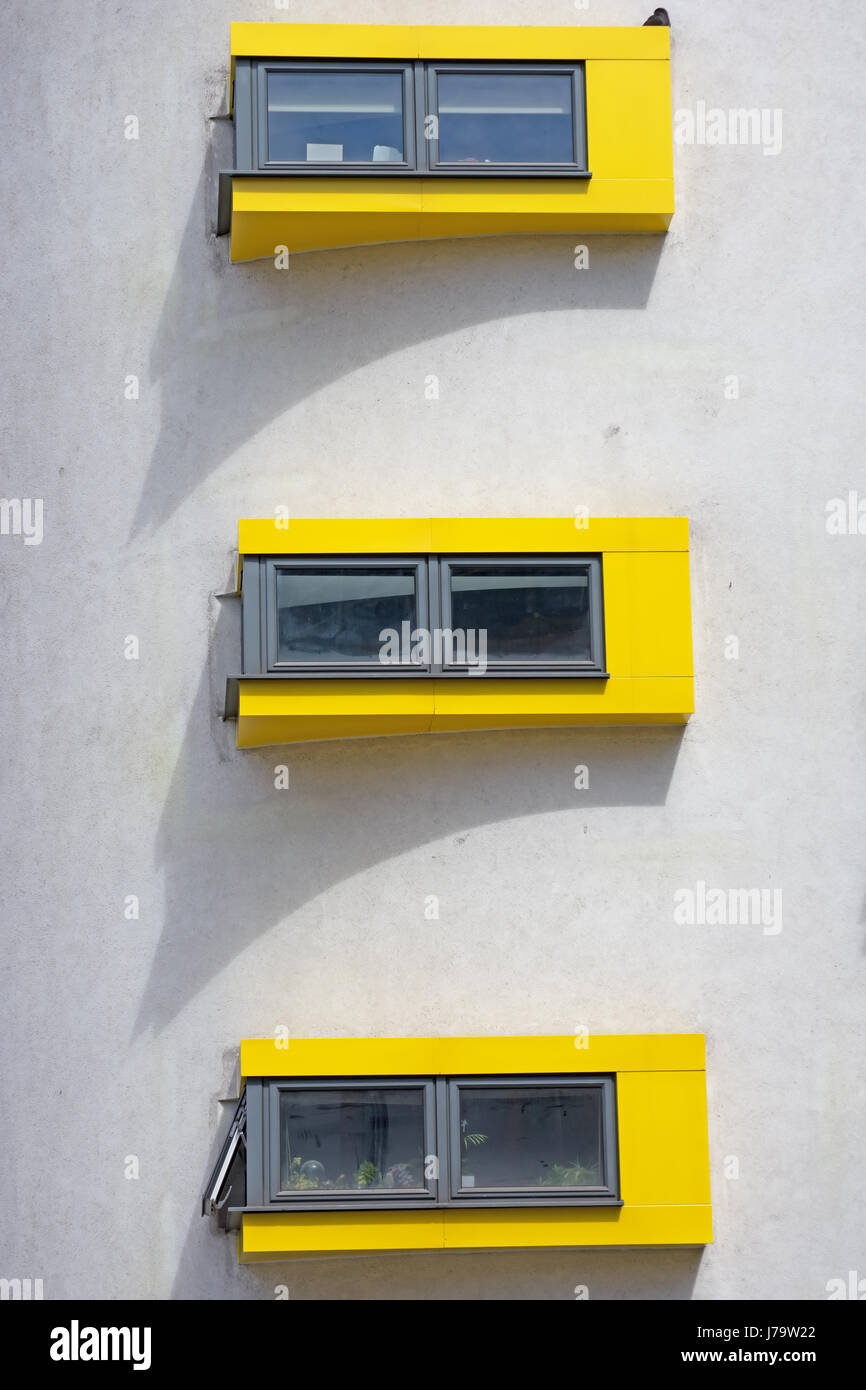 vertically alligned yellow framed windows at a branch of big yellow storage in kingston upon thames, surrey, england Stock Photo