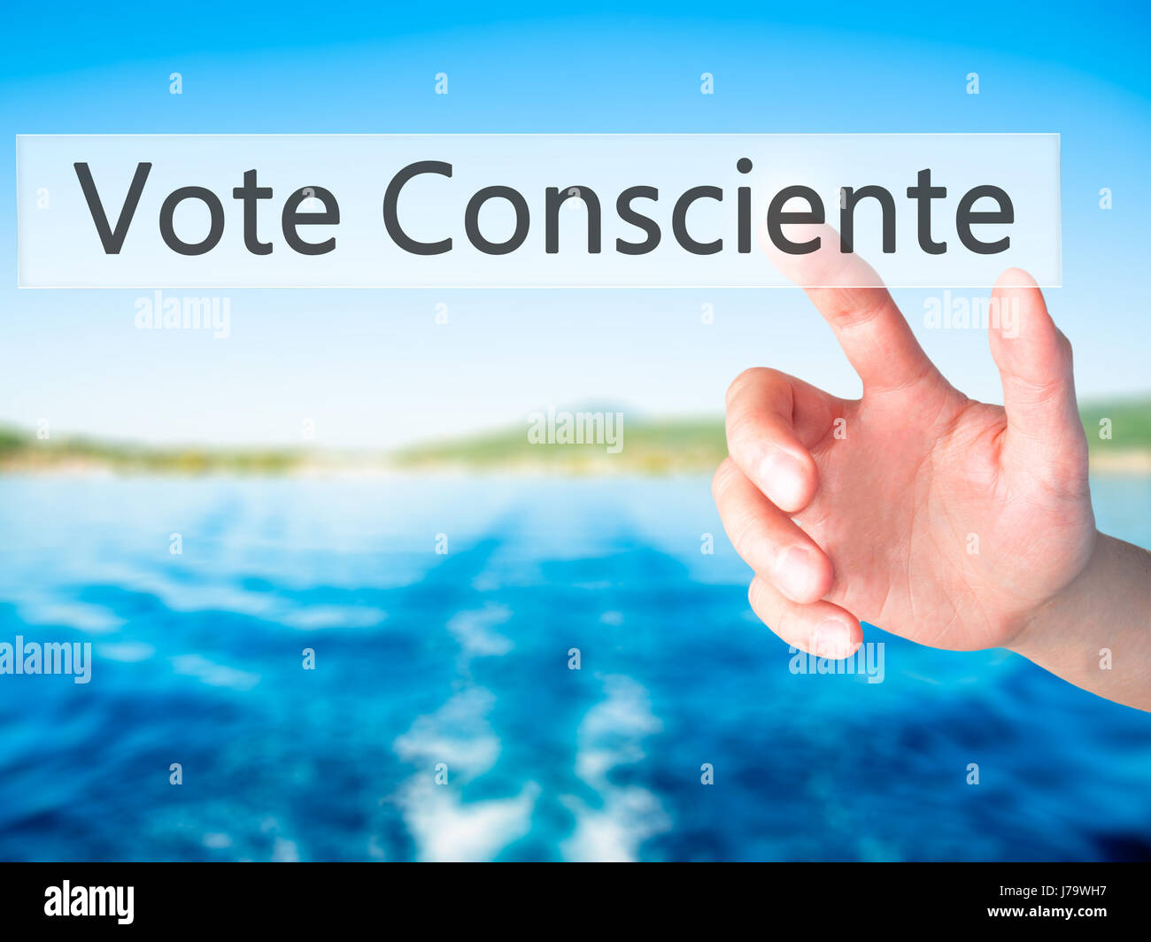 Vote Consciente - Hand pressing a button on blurred background concept . Business, technology, internet concept. Stock Photo Stock Photo