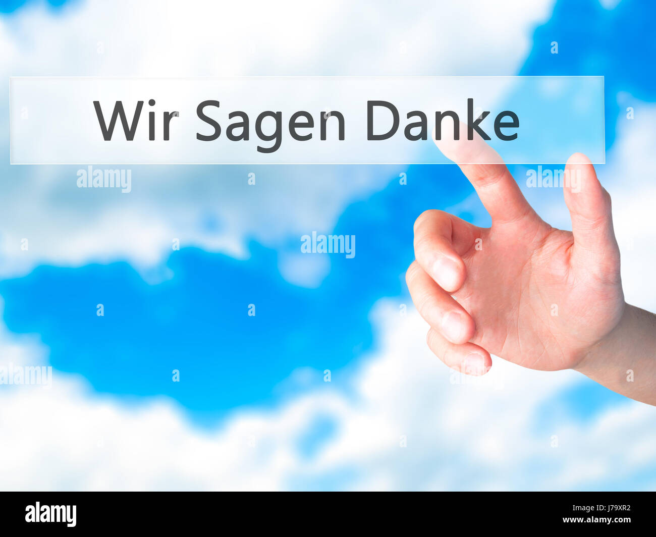 Wir Sagen Danke (We Say Thank You In German) - Hand pressing a button