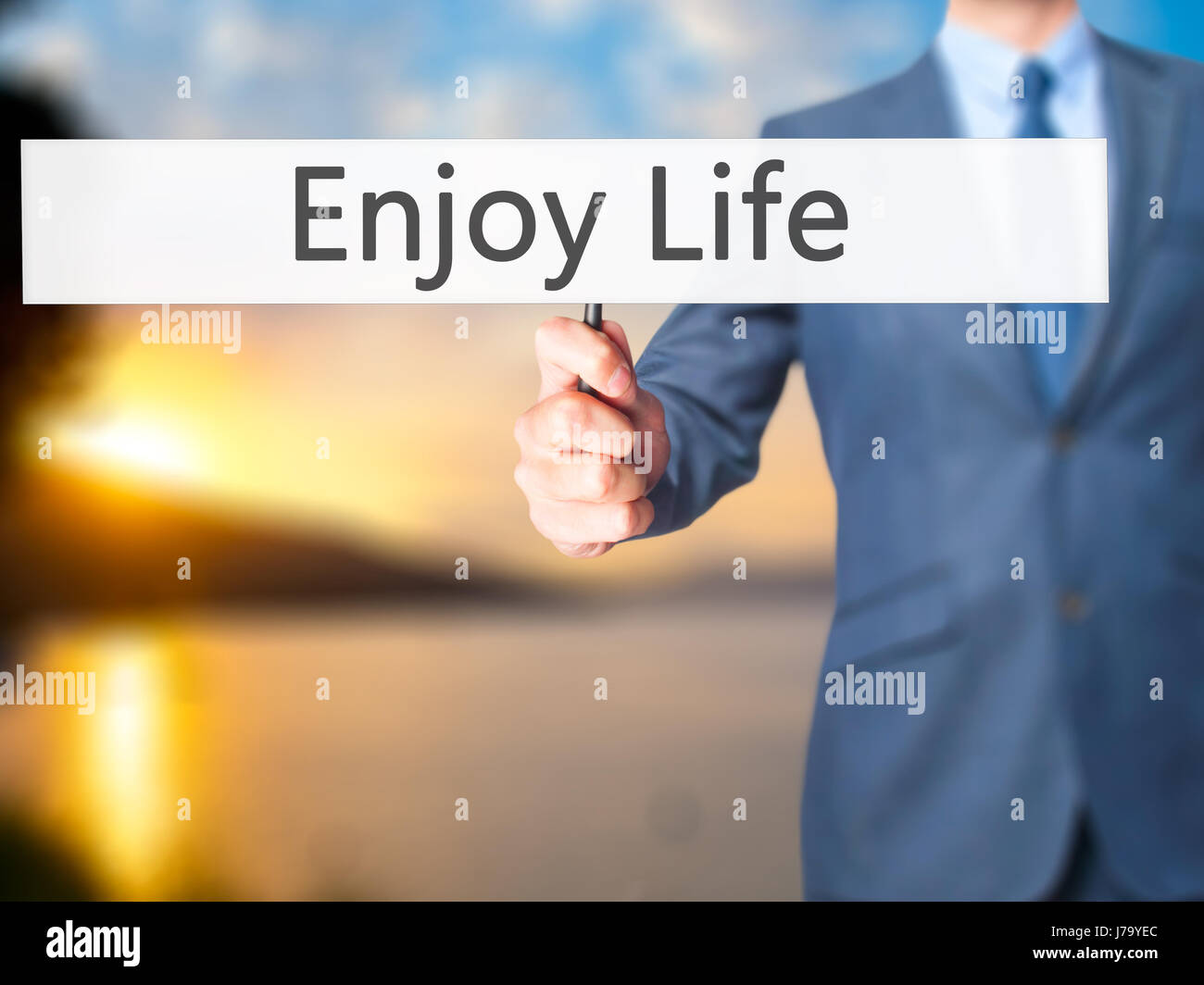 Enjoy Life - Businessman hand holding sign. Business, technology ...