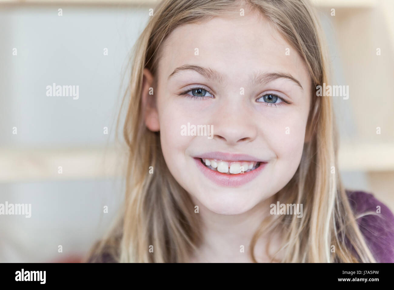 Portrait of smiling blond girl Stock Photo - Alamy