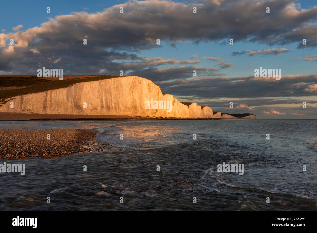 View to Seven Sisters Chalk Cliffs from Cuckmere Haven beach, sunset. Seven Sisters Country Park, Cuckmere Haven, Seaford Head, Seaford, Sussex, Engla Stock Photo