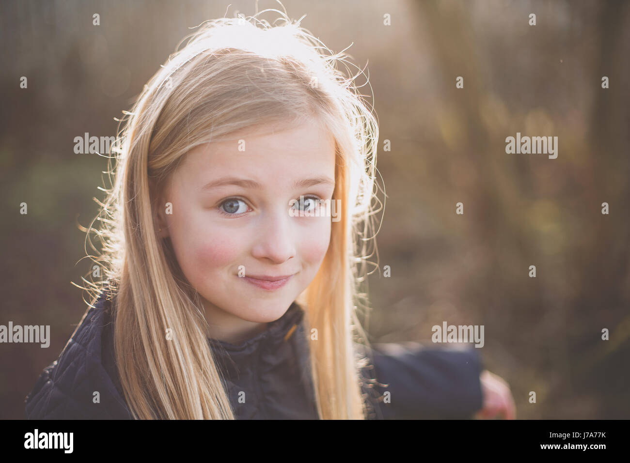 Portrait of a smiling girl outdoors Stock Photo