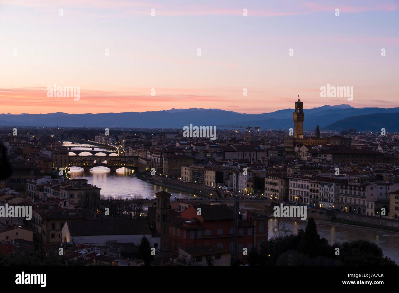 Italy, Tuscany, Florence, Sunset on bridge Palazzo Vecchio and river Arno Stock Photo