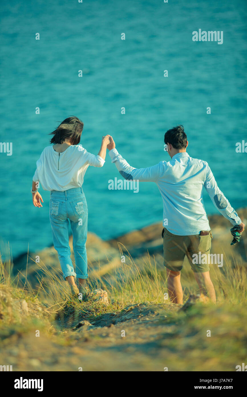 younger man and woman relaxing summer vacation Stock Photo