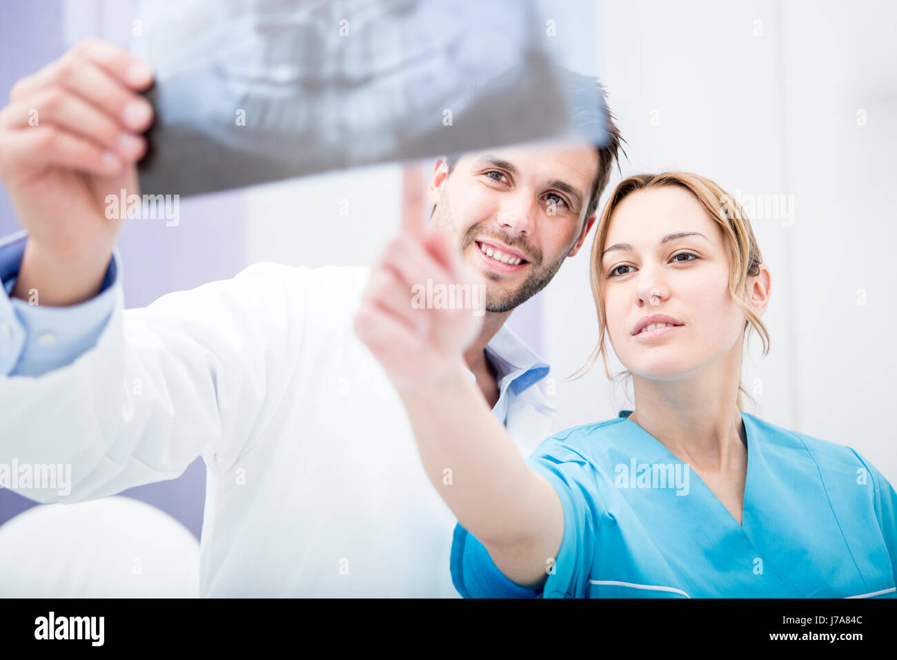 Two doctors discussing dental xray image Stock Photo Alamy