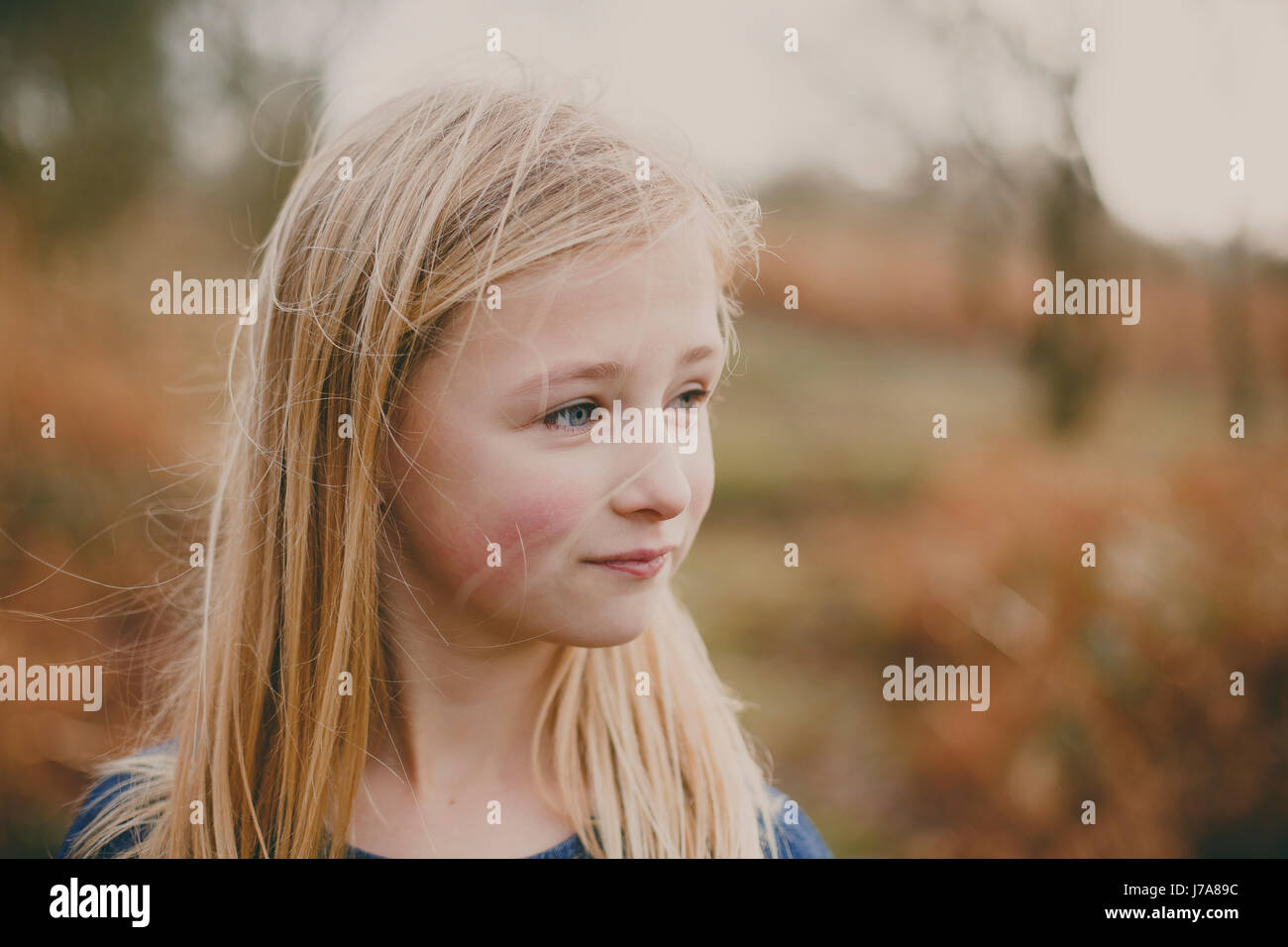 Portrait of a blond girl outdoors Stock Photo