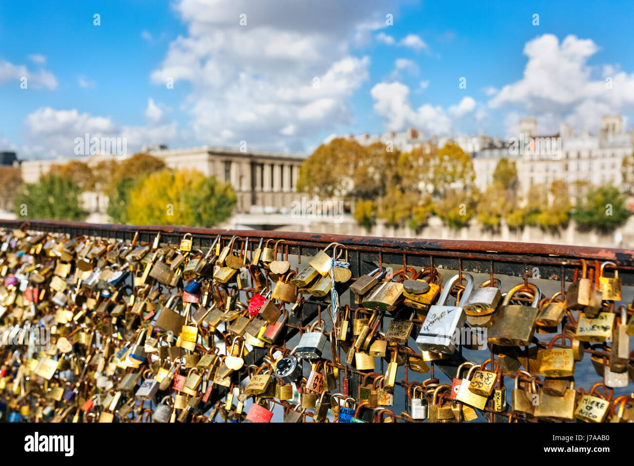 France, Paris, love locks at railing of a bridge over Seine River Stock Photo