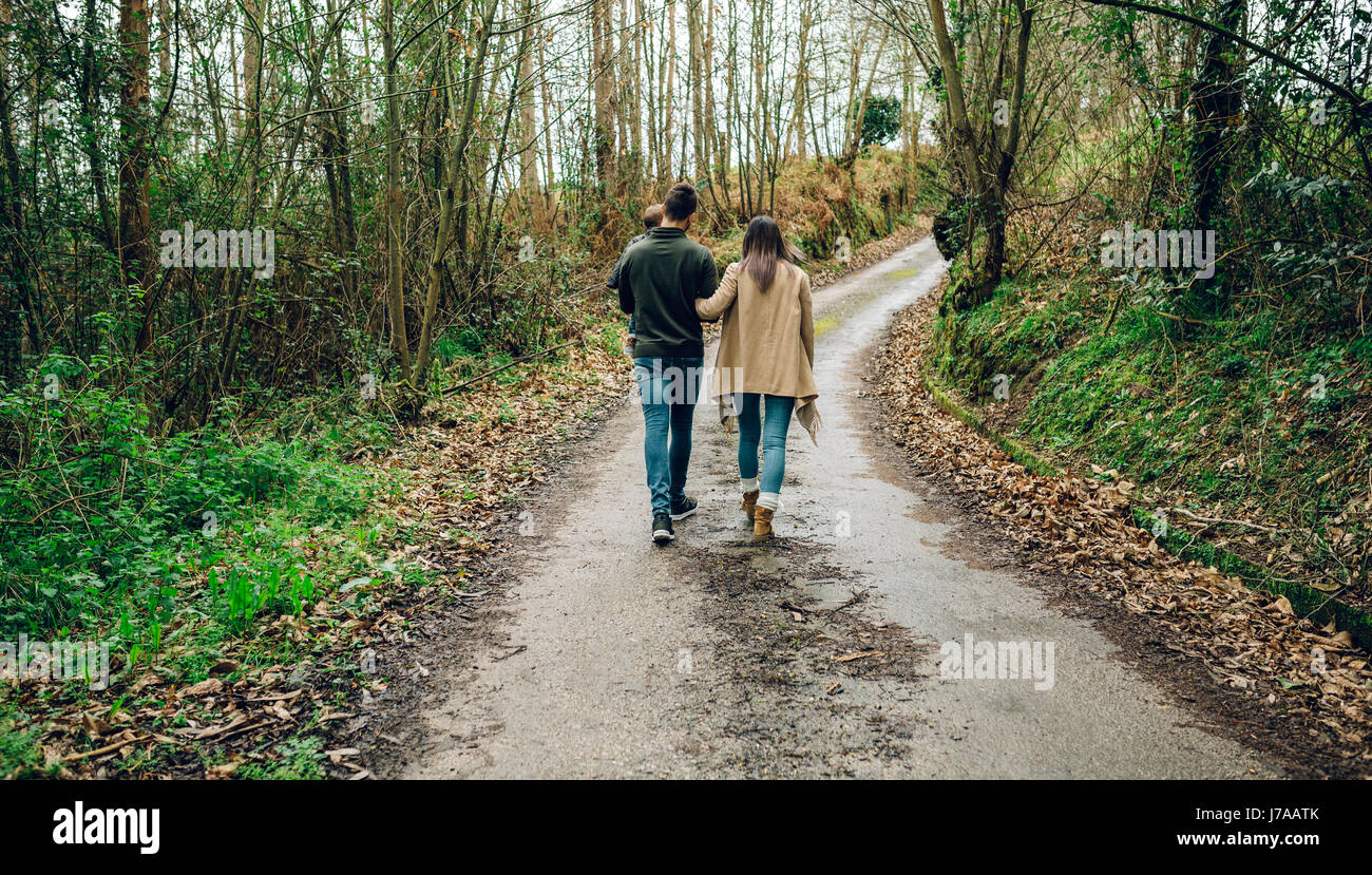 Back view of family walking in forest in autumn Stock Photo - Alamy