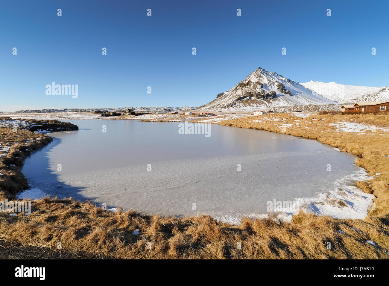 Iceland, Small frozen lake in Arnarstapi Stock Photo
